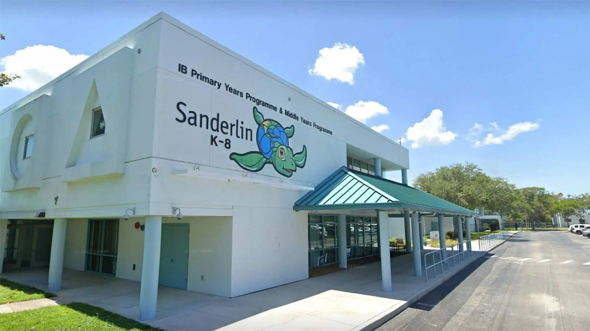 The front of Sanderlin K-8, with the school turtle and lettering for the IB Primary Years and Middle Years Programmes.